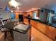 Modern kitchen with wood cabinets, granite counters, and island at 509 Jackson St, Eustis, FL 32726