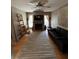 Living room with hardwood floors, fireplace, and comfy sofa at 509 Jackson St, Eustis, FL 32726