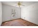 Bright bedroom featuring wood floors and a window at 5870 Se 158Th Ct, Ocklawaha, FL 32179