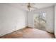 Bedroom with sliding glass door and ceiling fan at 5870 Se 158Th Ct, Ocklawaha, FL 32179