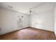 Simple bedroom with laminate wood flooring and a window at 5870 Se 158Th Ct, Ocklawaha, FL 32179