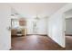 Dining area with laminate floors and kitchen access at 5870 Se 158Th Ct, Ocklawaha, FL 32179