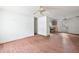 Living room with laminate floors and a view into the kitchen at 5870 Se 158Th Ct, Ocklawaha, FL 32179