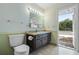 Bathroom with toilet and vanity, exterior access at 5938 Marlberry Dr, Orlando, FL 32819