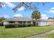 Ranch-style home with mature landscaping and a two car garage at 5938 Marlberry Dr, Orlando, FL 32819