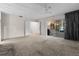 Living room with carpet, ceiling fan, and sliding glass doors at 5938 Marlberry Dr, Orlando, FL 32819