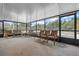 Relaxing screened patio with seating area overlooking the pool at 5938 Marlberry Dr, Orlando, FL 32819