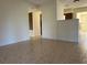 Bright dining room with tile floors and adjacent kitchen at 609 Scenic St, Leesburg, FL 34748