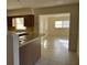 View of kitchen with wood cabinets and breakfast bar at 609 Scenic St, Leesburg, FL 34748