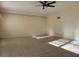 Large living area with tile floors and a ceiling fan at 609 Scenic St, Leesburg, FL 34748