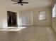 Bright living room with tile floors and access to other rooms at 609 Scenic St, Leesburg, FL 34748