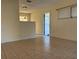 Living room features tile floors and exterior access at 609 Scenic St, Leesburg, FL 34748