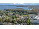 Aerial view showcasing home's location near a lake at 7 Ginger Cir, Leesburg, FL 34748