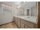 Bathroom with double vanity and tiled floor at 7 Ginger Cir, Leesburg, FL 34748