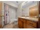 Bathroom featuring a vanity with decorative hardware and a shower with tub at 7 Ginger Cir, Leesburg, FL 34748