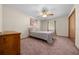 Bright bedroom with ceiling fan and dresser at 7 Ginger Cir, Leesburg, FL 34748