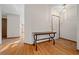 Bright entryway with tile and wood flooring, showcasing a console table at 7 Ginger Cir, Leesburg, FL 34748