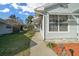 Side view showcasing the home's exterior and landscaping at 7 Ginger Cir, Leesburg, FL 34748