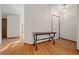 Inviting home foyer features stylish hardwood floors and a decorative table at 7 Ginger Cir, Leesburg, FL 34748