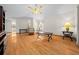 Spacious living room with hardwood floors, a ceiling fan, and comfortable seating area at 7 Ginger Cir, Leesburg, FL 34748