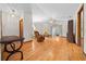 Living room with hardwood floors, wicker furniture, and patio access at 7 Ginger Cir, Leesburg, FL 34748