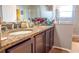 Bright bathroom with granite countertop double vanity at 702 Skyridge Rd, Clermont, FL 34711