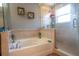 Bathroom with a soaking tub and walk-in shower at 702 Skyridge Rd, Clermont, FL 34711