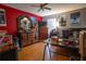 Bedroom with a dresser, desk, and movie posters at 702 Skyridge Rd, Clermont, FL 34711