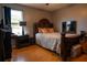 Bedroom with a large bed and a window with natural light at 702 Skyridge Rd, Clermont, FL 34711