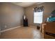 Simple bedroom with tile floors and large window at 702 Skyridge Rd, Clermont, FL 34711