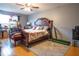 Main bedroom with a large bed and walk-in closet at 702 Skyridge Rd, Clermont, FL 34711