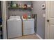 Functional laundry room with shelving for storage at 702 Skyridge Rd, Clermont, FL 34711