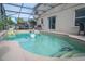 Refreshing pool with covered patio and seating at 702 Skyridge Rd, Clermont, FL 34711