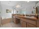 Bathroom with double vanity, tub and shower combo at 7023 Arcadian Ct, Mount Dora, FL 32757