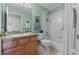 Clean bathroom with a tub, toilet and vanity at 7023 Arcadian Ct, Mount Dora, FL 32757