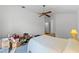 Bedroom with ceiling fan and carpet flooring at 7023 Arcadian Ct, Mount Dora, FL 32757