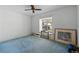 Bedroom with carpet, ceiling fan, and window with natural light at 7023 Arcadian Ct, Mount Dora, FL 32757