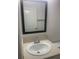 Bathroom with vanity, sink, and a large mirror at 7268 Annison Ter, The Villages, FL 32163