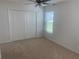 Bright bedroom with double door closet and neutral carpet at 7268 Annison Ter, The Villages, FL 32163