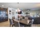 Dining area with dark wood table and chairs, adjacent to kitchen at 742 Franklin Ct, Haines City, FL 33844