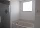 Updated bathroom with a soaking tub and glass shower at 7558 Sw 103Rd Loop, Ocala, FL 34476