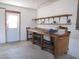 Garage workshop with workbench and shelving at 7558 Sw 103Rd Loop, Ocala, FL 34476