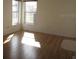 Bright and airy living room with hardwood floors and large windows at 7558 Sw 103Rd Loop, Ocala, FL 34476