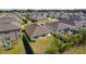 Aerial view of the house and surrounding neighborhood at 8661 Triumph Cir, Wildwood, FL 34785