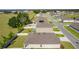 Aerial view of houses and street in a residential neighborhood at 8661 Triumph Cir, Wildwood, FL 34785