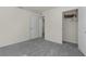 Spacious bedroom with carpeted floor and a large closet at 8661 Triumph Cir, Wildwood, FL 34785