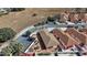 Aerial view of backyard patios and driveways at 878 Oviedo Rd, The Villages, FL 32159