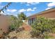 This charming backyard features lemon trees, decorative rocks, and a concrete patio at 878 Oviedo Rd, The Villages, FL 32159