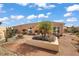 An exterior view of the home's backyard, complete with concrete patio and a central, landscaped garden at 878 Oviedo Rd, The Villages, FL 32159