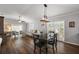 Open floorplan living room with modern lighting and plank floors at 878 Oviedo Rd, The Villages, FL 32159